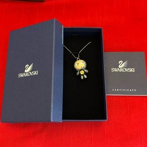 Swarovski character necklace in the box with a long original chain.